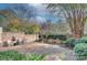 Private brick courtyard with fountain and landscaping at 5635 Ballinard Ln, Charlotte, NC 28277