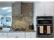 Stainless steel appliances and granite countertops in a white kitchen at 5635 Ballinard Ln, Charlotte, NC 28277