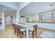 Kitchen with breakfast bar and white cabinets at 5635 Ballinard Ln, Charlotte, NC 28277