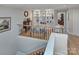 Upstairs library with built-in shelves and comfortable seating at 5635 Ballinard Ln, Charlotte, NC 28277