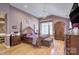 Spacious main bedroom with hardwood floors and large windows at 5635 Ballinard Ln, Charlotte, NC 28277