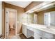 Bathroom featuring double sinks and an adjacent toilet room at 7943 Oratorio Pl, Charlotte, NC 28270