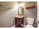 A half bathroom with a vanity and toilet at 7943 Oratorio Pl, Charlotte, NC 28270