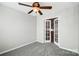 Bedroom featuring a ceiling fan and adjoining room, creating more livable space at 7943 Oratorio Pl, Charlotte, NC 28270