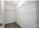 A walk-in closet with carpet and metal shelving at 7943 Oratorio Pl, Charlotte, NC 28270