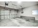 A two car garage featuring an automatic door opener, and sealed concrete floors at 7943 Oratorio Pl, Charlotte, NC 28270