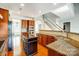 Kitchen featuring wood cabinets, granite countertops, and a kitchen island at 7943 Oratorio Pl, Charlotte, NC 28270