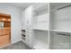 Well-organized walk-in closet with built-in storage and easy access at 7943 Oratorio Pl, Charlotte, NC 28270