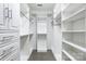 Spacious walk-in closet with custom shelving and ample storage space at 7943 Oratorio Pl, Charlotte, NC 28270