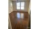 View of the dining room showcasing hardwood floors and a light fixture at 8350 Nc Hwy 90 E Hwy, Stony Point, NC 28678