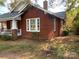 Charming red brick house with a cozy porch and traditional architecture at 8350 Nc Hwy 90 E Hwy, Stony Point, NC 28678