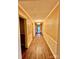 Long hallway featuring wood floors and decorative wall trim at 8350 Nc Hwy 90 E Hwy, Stony Point, NC 28678