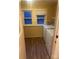 The laundry room is equipped with washer, dryer, and laminate flooring at 8350 Nc Hwy 90 E Hwy, Stony Point, NC 28678