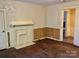 Cozy living room with decorative fireplace, beautiful hardwood floors and natural light at 8350 Nc Hwy 90 E Hwy, Stony Point, NC 28678