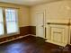 Cozy living room with decorative fireplace, beautiful hardwood floors and natural light at 8350 Nc Hwy 90 E Hwy, Stony Point, NC 28678