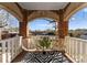 Charming balcony with brick arch, two wicker chairs, decorative rug, and cityscape view at 843 Ideal Way # 11, Charlotte, NC 28203