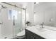 Modern bathroom with a glass-enclosed shower, stylish vanity, and neutral white tiling at 843 Ideal Way # 11, Charlotte, NC 28203