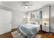 Bright bedroom featuring natural light, wood floors, ceiling fan, and bedside tables with lamps at 843 Ideal Way # 11, Charlotte, NC 28203