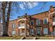 Charming brick apartment building with a quaint balcony and inviting entrance under a partly sunny sky at 843 Ideal Way # 11, Charlotte, NC 28203