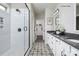 Modern bathroom featuring a glass shower, patterned floors, and a double vanity at 9130 Dulwich Dr # Ken0079, Charlotte, NC 28215