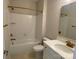 Well-lit bathroom featuring a tub, shower, vanity, and gold fixtures at 9130 Dulwich Dr # Ken0079, Charlotte, NC 28215