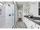 Elegant bathroom with double vanity, frameless shower, and patterned floor tile at 9130 Dulwich Dr # Ken0079, Charlotte, NC 28215