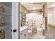 Charming bathroom with floral shower curtain and white vanity at 9130 Dulwich Dr # Ken0079, Charlotte, NC 28215