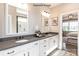 Modern bathroom with double vanities, quartz counters and decorative floral flooring at 9130 Dulwich Dr # Ken0079, Charlotte, NC 28215