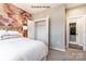 Comfortable bedroom featuring a unique accent wall and ample closet space at 9130 Dulwich Dr # Ken0079, Charlotte, NC 28215