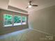 Bedroom featuring natural light, a ceiling fan, and a tray ceiling at 9130 Dulwich Dr # Ken0079, Charlotte, NC 28215