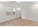 Light bedroom with hardwood floors, a large window, and closet at 9130 Dulwich Dr # Ken0079, Charlotte, NC 28215