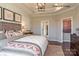 Spacious bedroom with wood bed frame and patterned bedding at 9130 Dulwich Dr # Ken0079, Charlotte, NC 28215