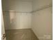 Walk-in closet with ample shelving, perfect for organizing your wardrobe and accessories at 9130 Dulwich Dr # Ken0079, Charlotte, NC 28215