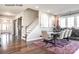 Bright dining room features hardwood floors and a modern chandelier at 9130 Dulwich Dr # Ken0079, Charlotte, NC 28215