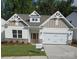 Charming new construction home with a two-car garage and nicely landscaped front yard at 9130 Dulwich Dr # Ken0079, Charlotte, NC 28215