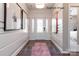 Inviting foyer featuring hardwood floors and decorative wall panels at 9130 Dulwich Dr # Ken0079, Charlotte, NC 28215