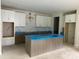 Spacious kitchen with white cabinets, marble backsplash, and large island perfect for entertaining at 9130 Dulwich Dr # Ken0079, Charlotte, NC 28215