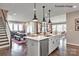 Island kitchen with white cabinets, stainless steel appliances, and hardwood floors at 9130 Dulwich Dr # Ken0079, Charlotte, NC 28215