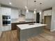 Modern kitchen with island, quartz countertops, and stainless steel appliances at 9130 Dulwich Dr # Ken0079, Charlotte, NC 28215