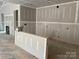 Spacious kitchen area ready for customization with modern drywall and fireplace in new construction home at 9130 Dulwich Dr # Ken0079, Charlotte, NC 28215