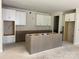 Spacious kitchen features a large island, custom cabinets and ample counter space at 9130 Dulwich Dr # Ken0079, Charlotte, NC 28215