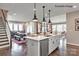 Open-concept kitchen featuring a large island, stainless steel appliances, and modern pendant lighting at 9130 Dulwich Dr # Ken0079, Charlotte, NC 28215