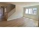 Bright living area with hardwood floors and large windows at 9130 Dulwich Dr # Ken0079, Charlotte, NC 28215