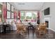 Living room with sectional sofa, fireplace, and large windows at 9130 Dulwich Dr # Ken0079, Charlotte, NC 28215