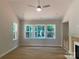 Bright living room with hardwood floors and a large window offering a view of the backyard at 9130 Dulwich Dr # Ken0079, Charlotte, NC 28215