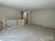Bright and airy loft with neutral walls, showcasing a white railing at 9130 Dulwich Dr # Ken0079, Charlotte, NC 28215