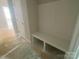 A mudroom with a built-in bench and storage, perfect for organization and functionality at 9130 Dulwich Dr # Ken0079, Charlotte, NC 28215