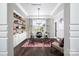 This well-lit office features custom built-ins, a modern desk, and elegant decor at 9130 Dulwich Dr # Ken0079, Charlotte, NC 28215