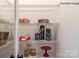 Organized pantry with wire shelving displaying storage jars and decorative items at 9130 Dulwich Dr # Ken0079, Charlotte, NC 28215