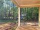 View from the covered patio overlooking the wooded backyard at 9130 Dulwich Dr # Ken0079, Charlotte, NC 28215